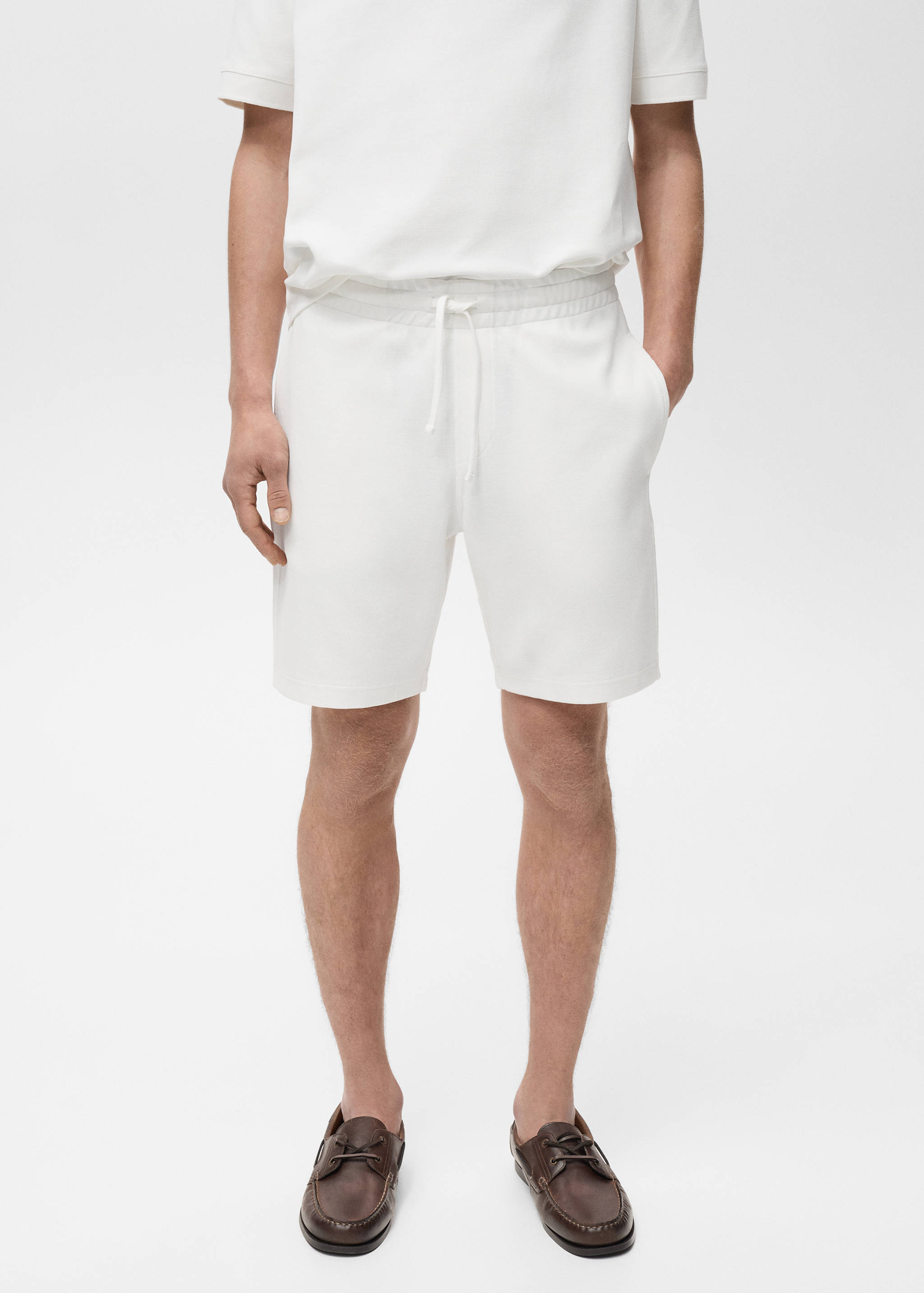 Structured knitted shorts - Medium plane