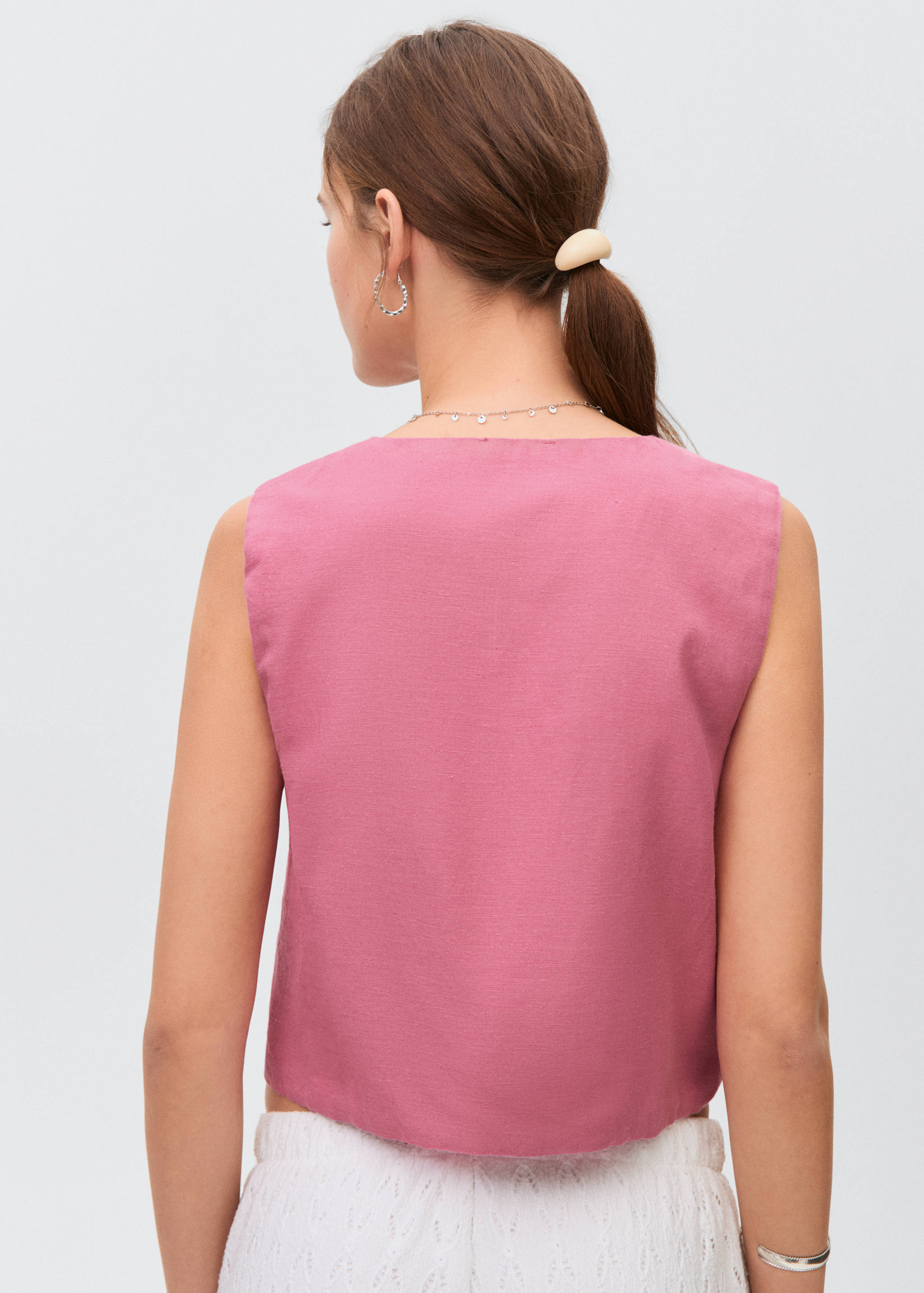 Embroidered vest with bows - Reverse of the article