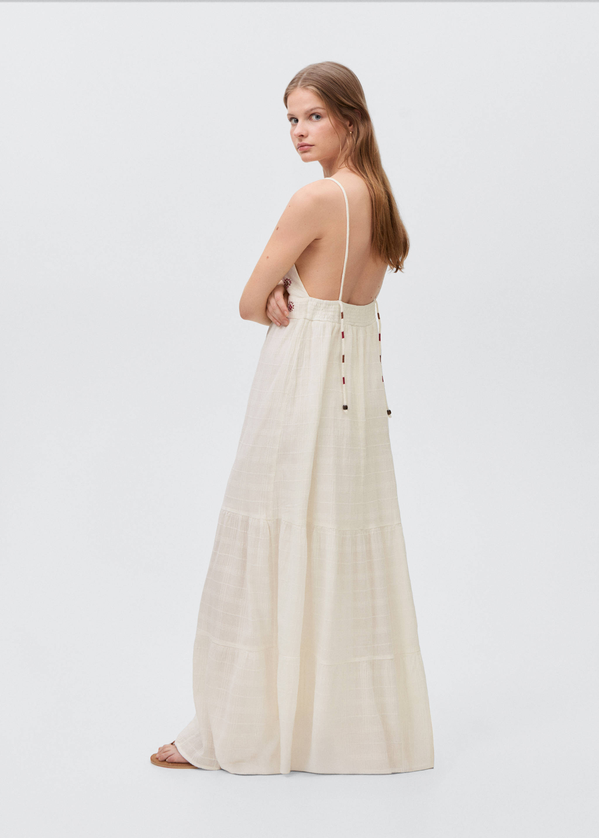 Embroidered dress with suns - Reverse of the article