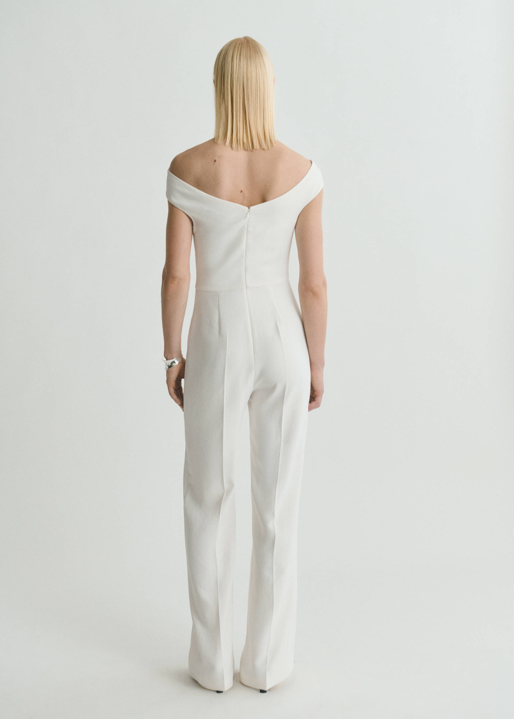 Long jumpsuit with asymmetrical neck - Reverse of the article