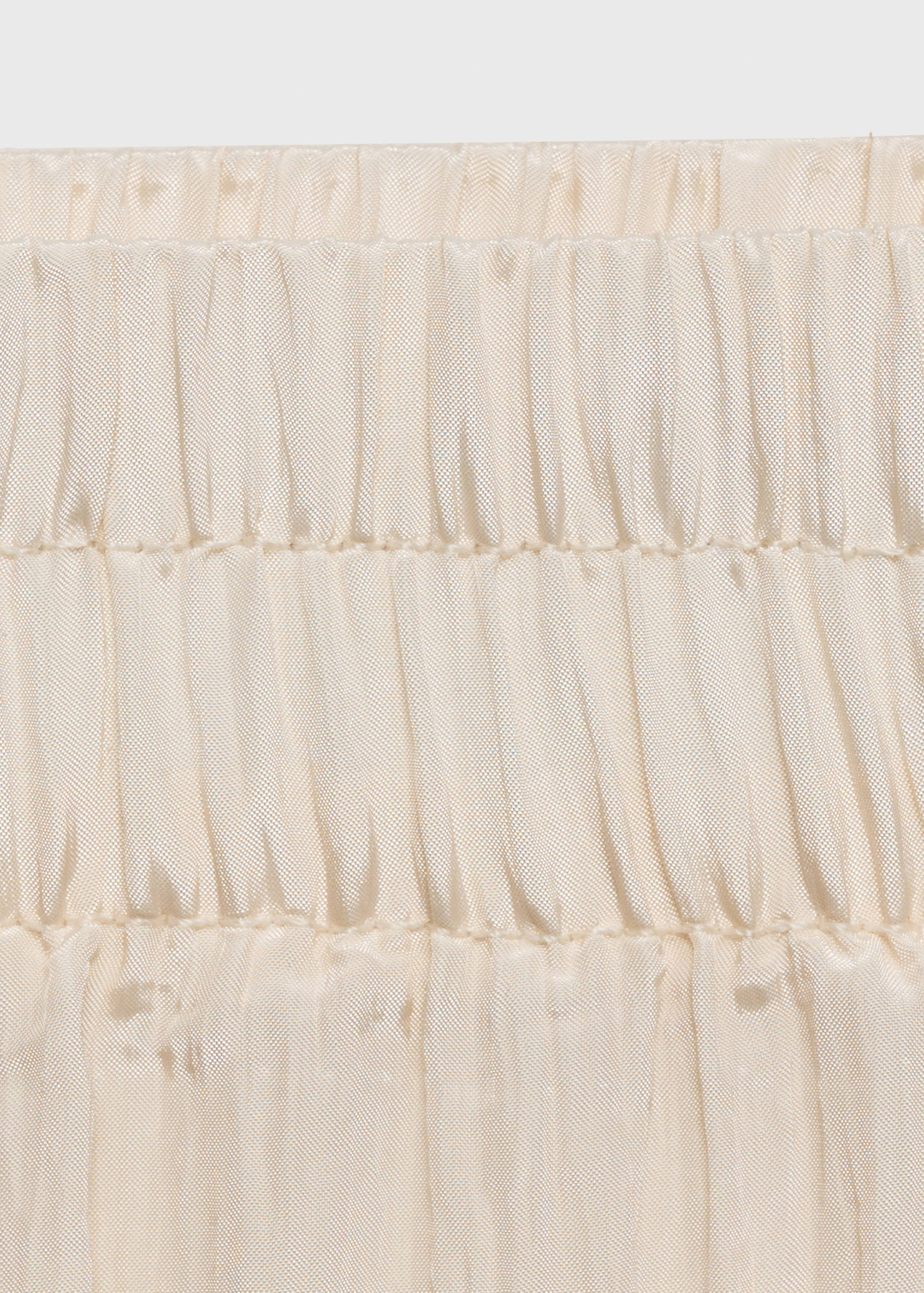 Rechte geplooide broek - Detail van het artikel 8