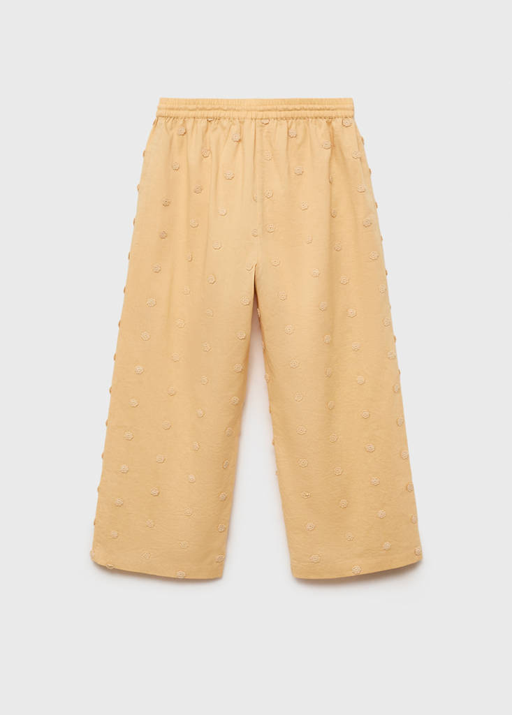 Long trousers with embroidered details — Mustard