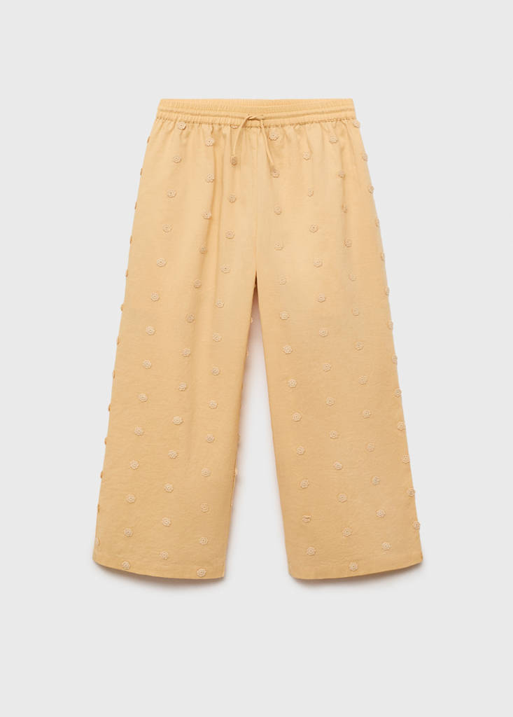 Long trousers with embroidered details — Mustard