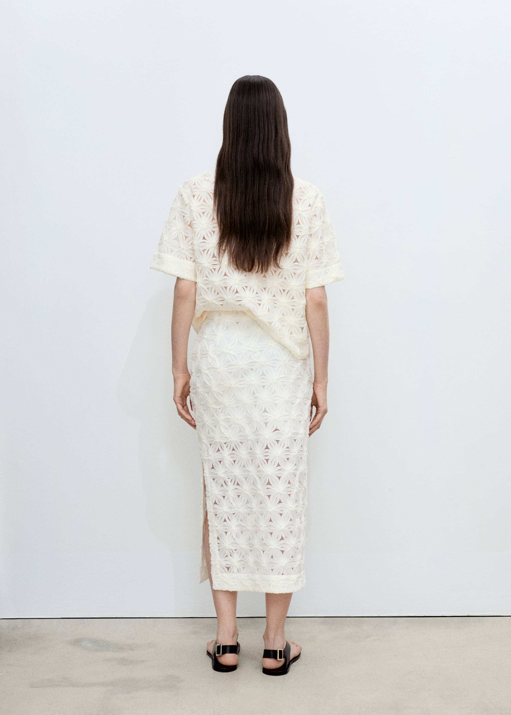 Faldilla calada textura flors - Revers de l'article