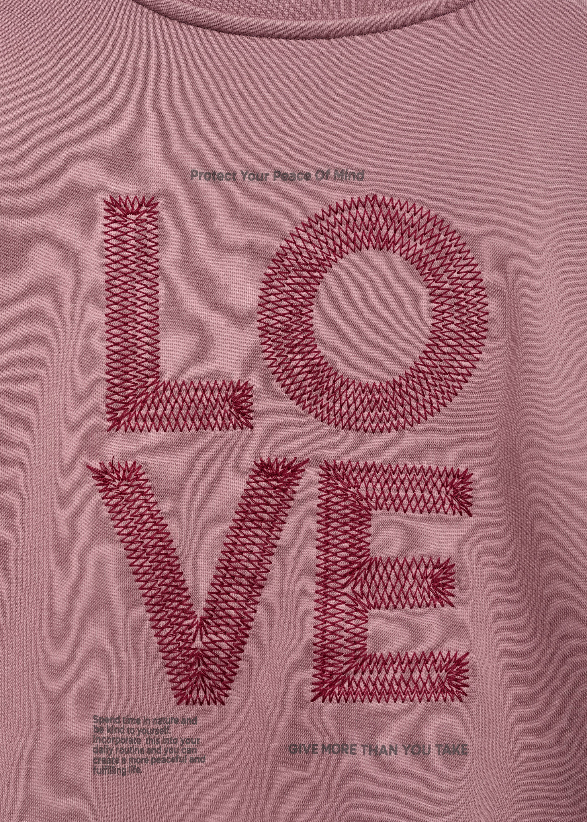 Dessuadora missatge brodat - Detall de l'article 0