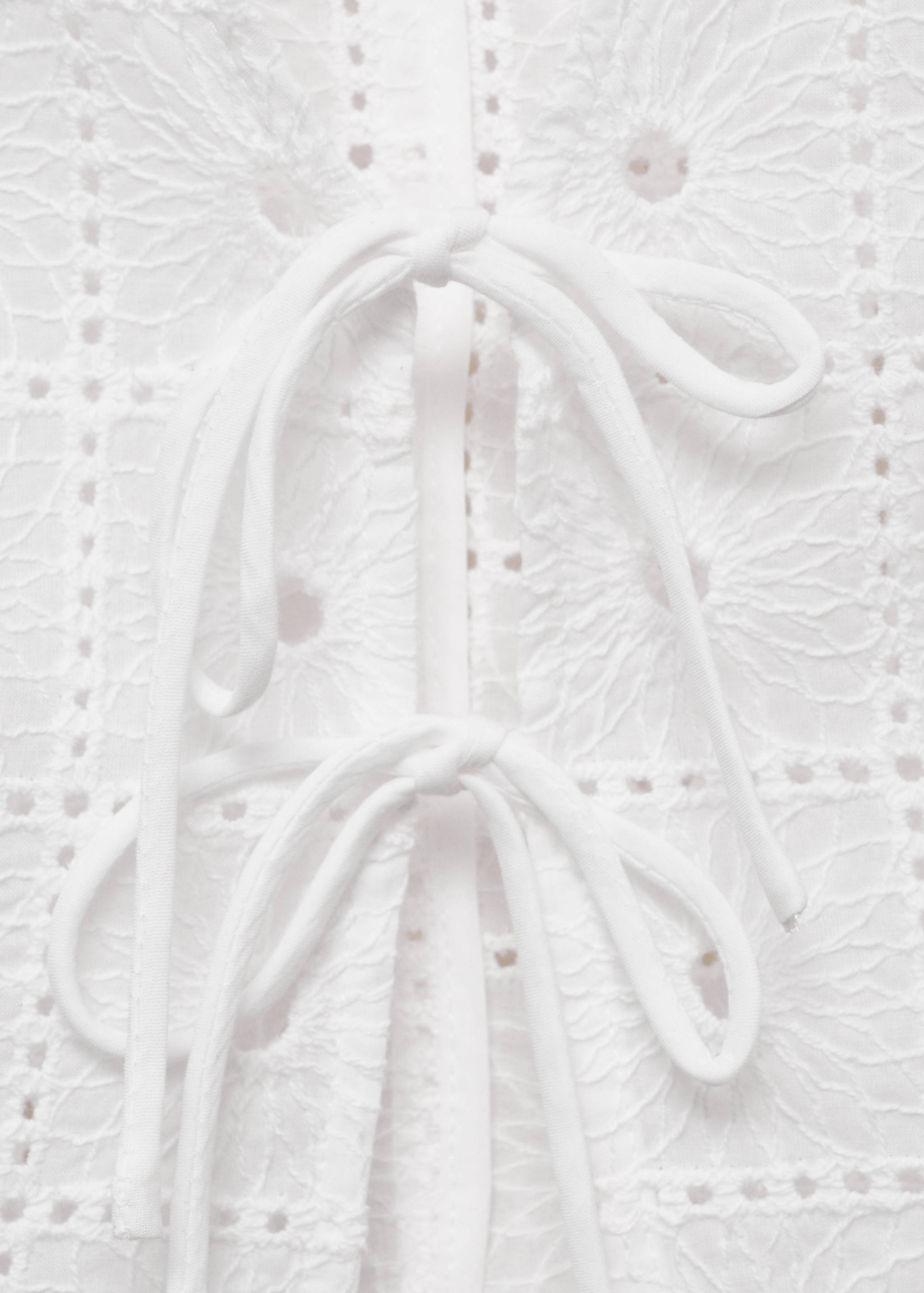 Embroidered cotton vest with bows - Details of the article 8