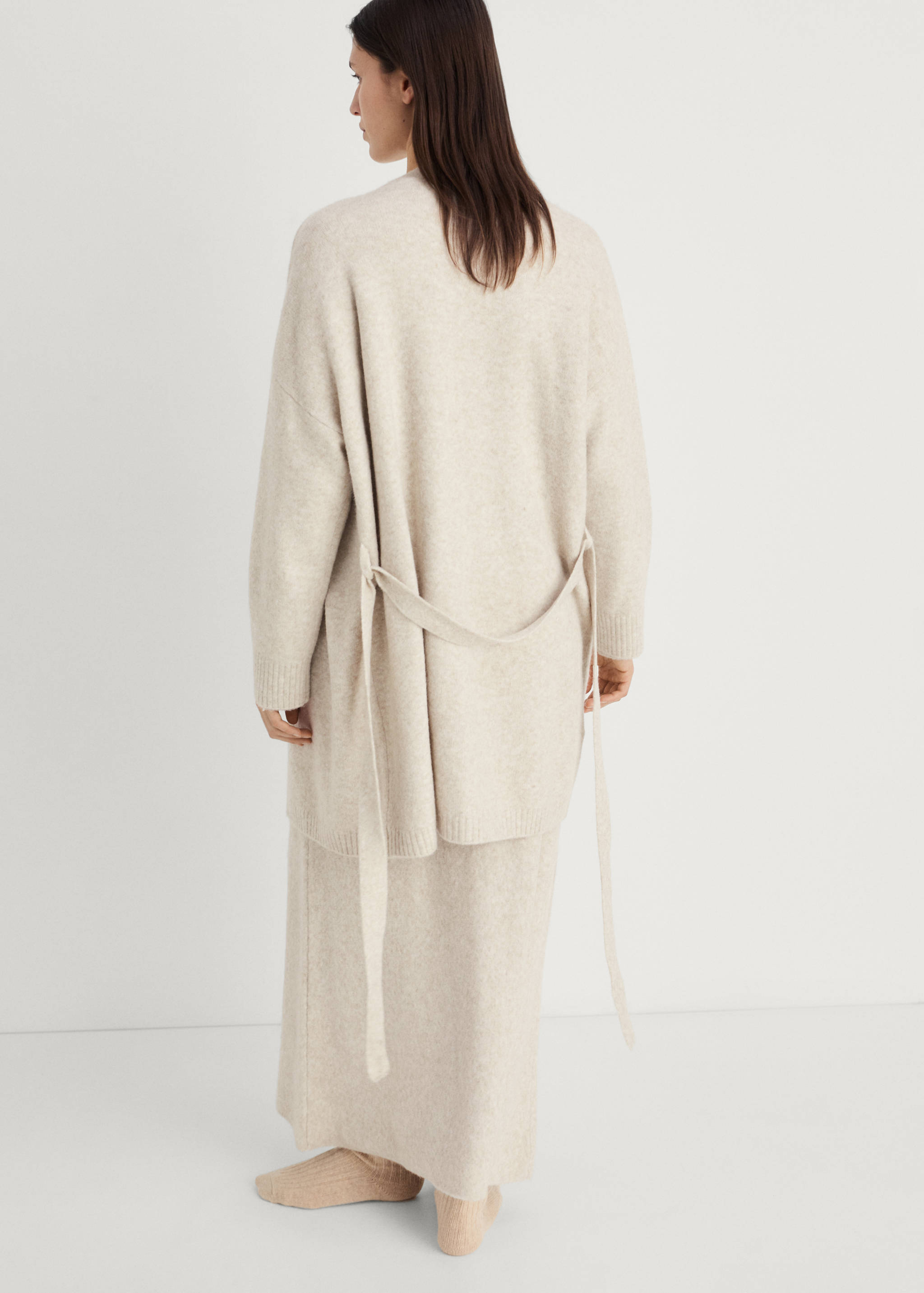 Short knitted cardigan - Reverse of the article