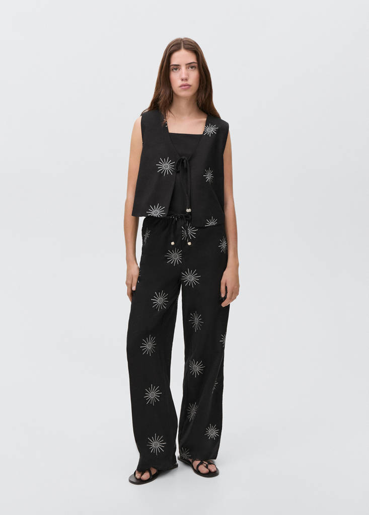 Long trousers with embroidered details — Black