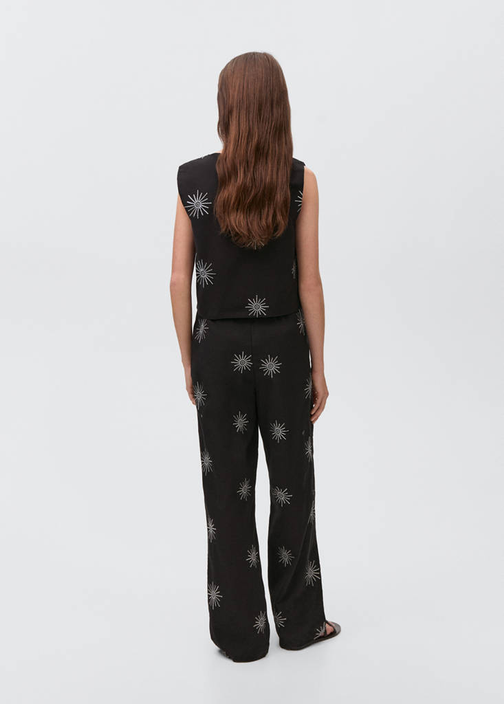 Long trousers with embroidered details — Black