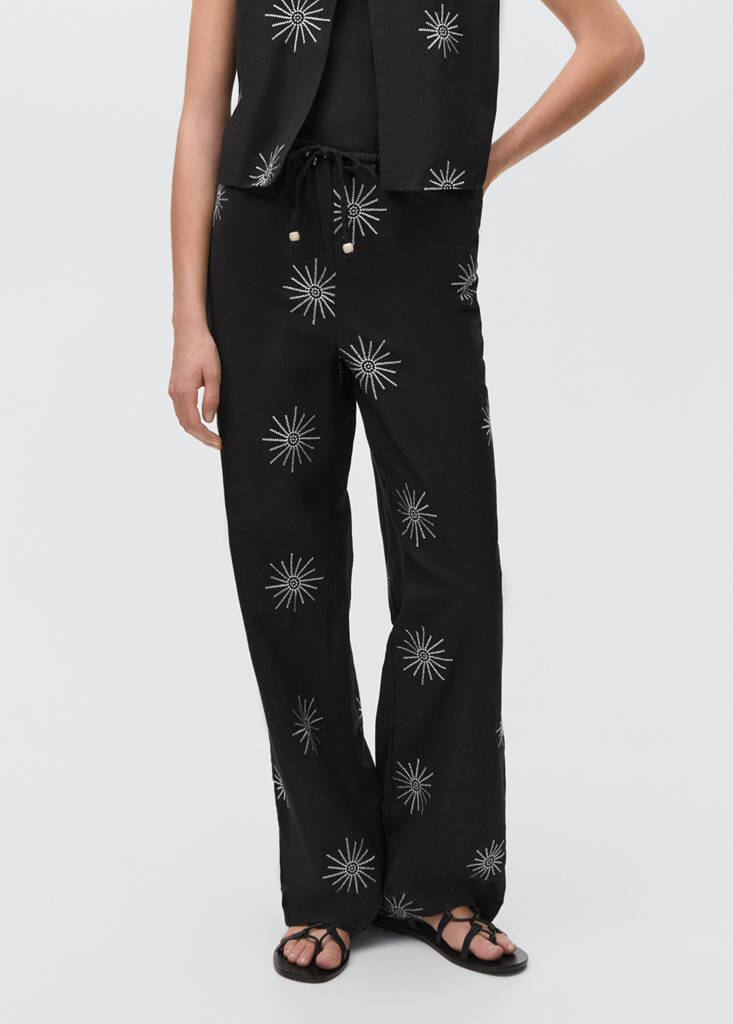 Long trousers with embroidered details — Black