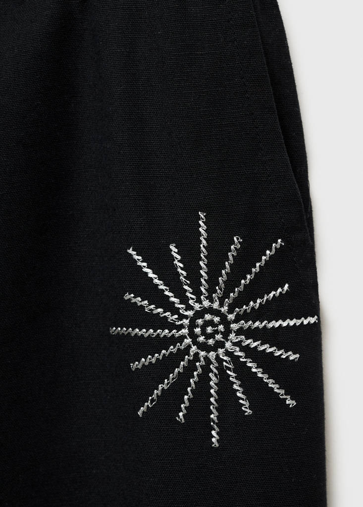 Long trousers with embroidered details — Black