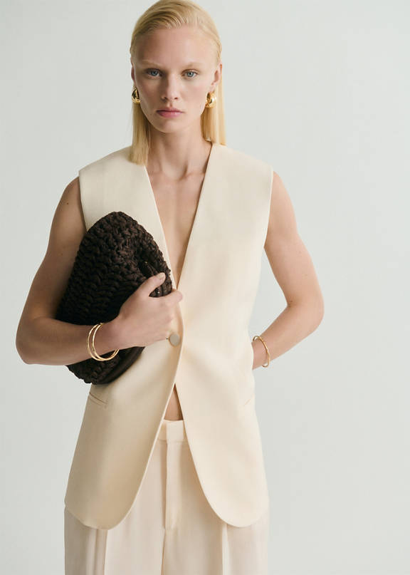 Two-piece women's wedding guest outfit.