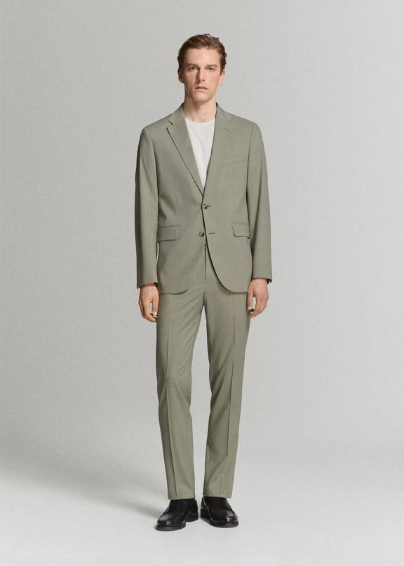 Summer casual men's wedding guest.
