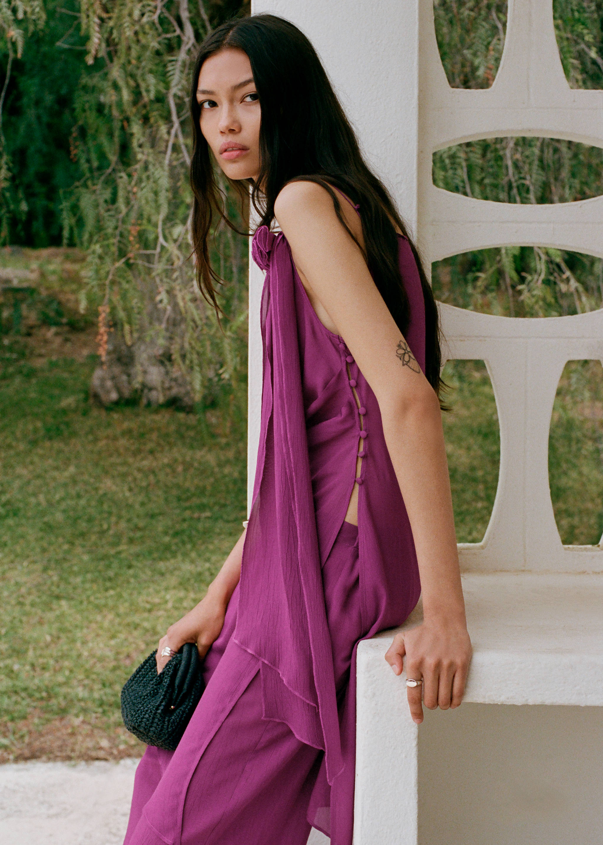 Two-piece women's wedding guest outfit.