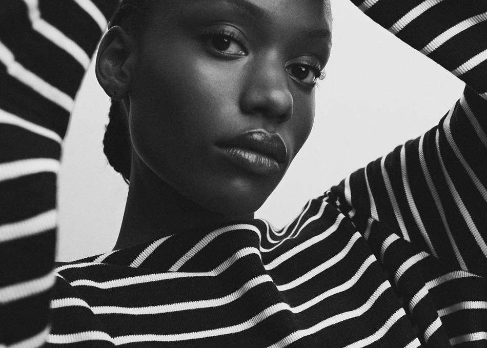 Woman wearing a black and white striped sweater