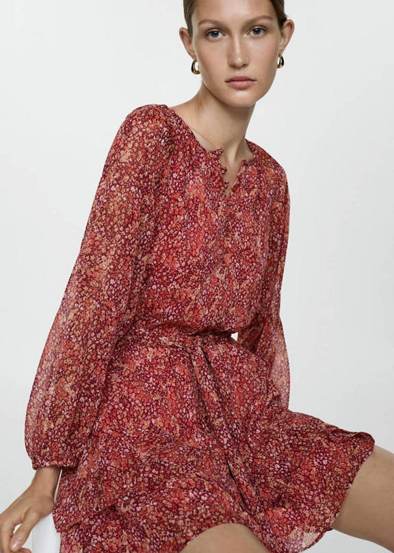 Woman wearing a boho style winter concert look.
