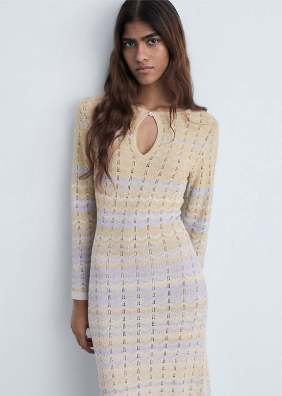 Woman wearing a long striped knit dress