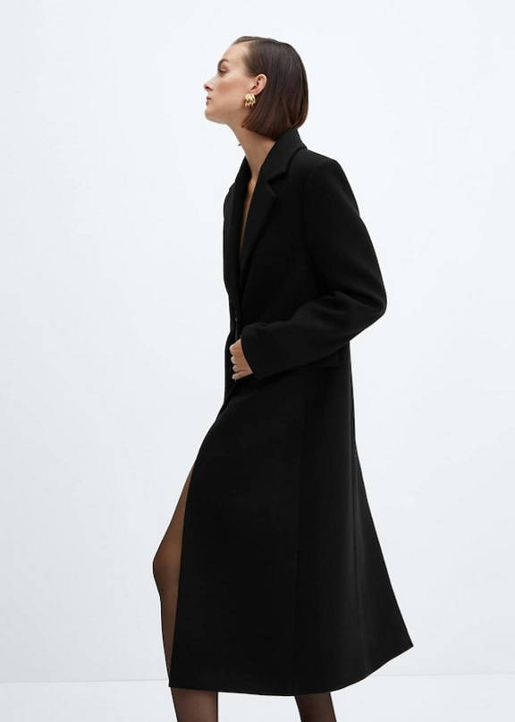 Woman wearing a type of long coat.