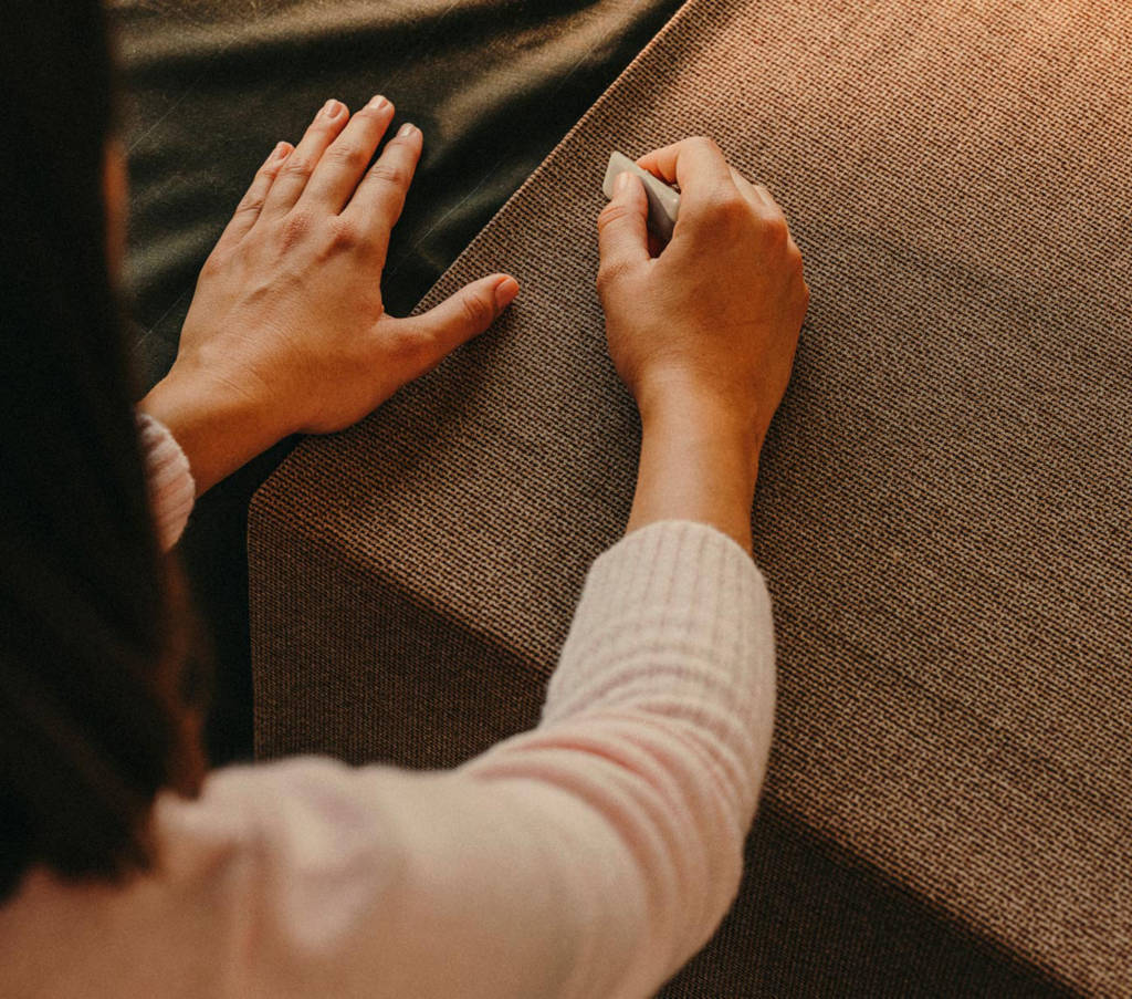 Hands working on fabric