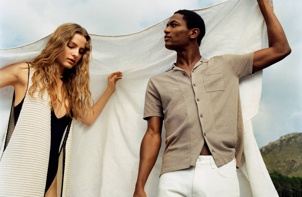 Models holding white fabric